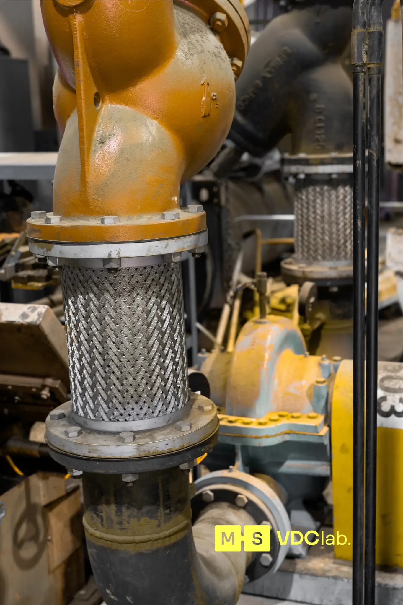 Pipe strainer and flexible connector on mechanical piping